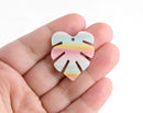 2 White Monstera Leaf Charms with Pastel Rainbow Stripes in Blue, Yellow and Pink, Cellulose Acetate, 29.5 x 26mm