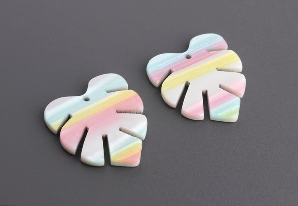 2 White Monstera Leaf Charms with Pastel Rainbow Stripes in Blue, Yellow and Pink, Cellulose Acetate, 29.5 x 26mm